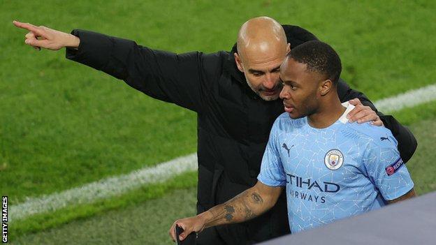 Raheem Sterling receives instructions from Pep Guardiola